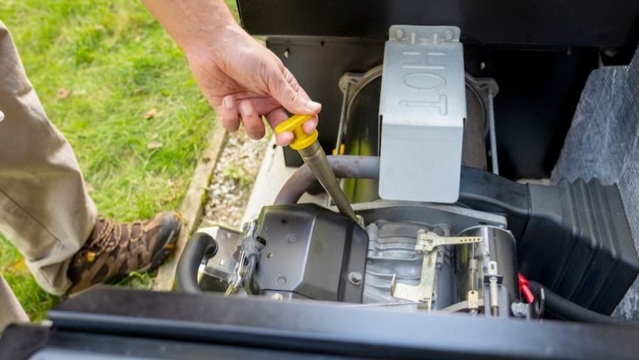Electrician performing maintenance on home generator